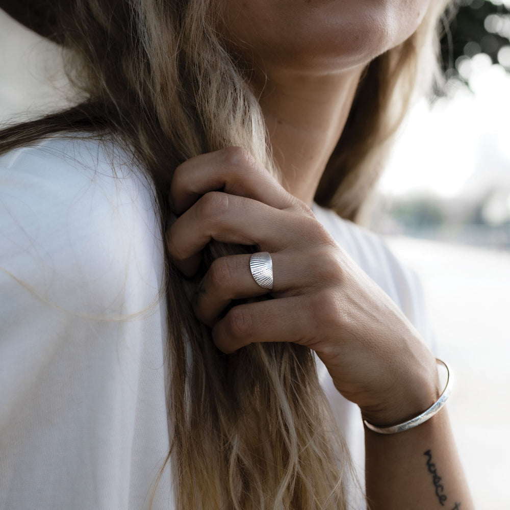 
                      
                        Vintage inspired simple Sunburst charm ring in sterling silver. Custom Handmade by jewelers in Brooklyn, NY.
                      
                    