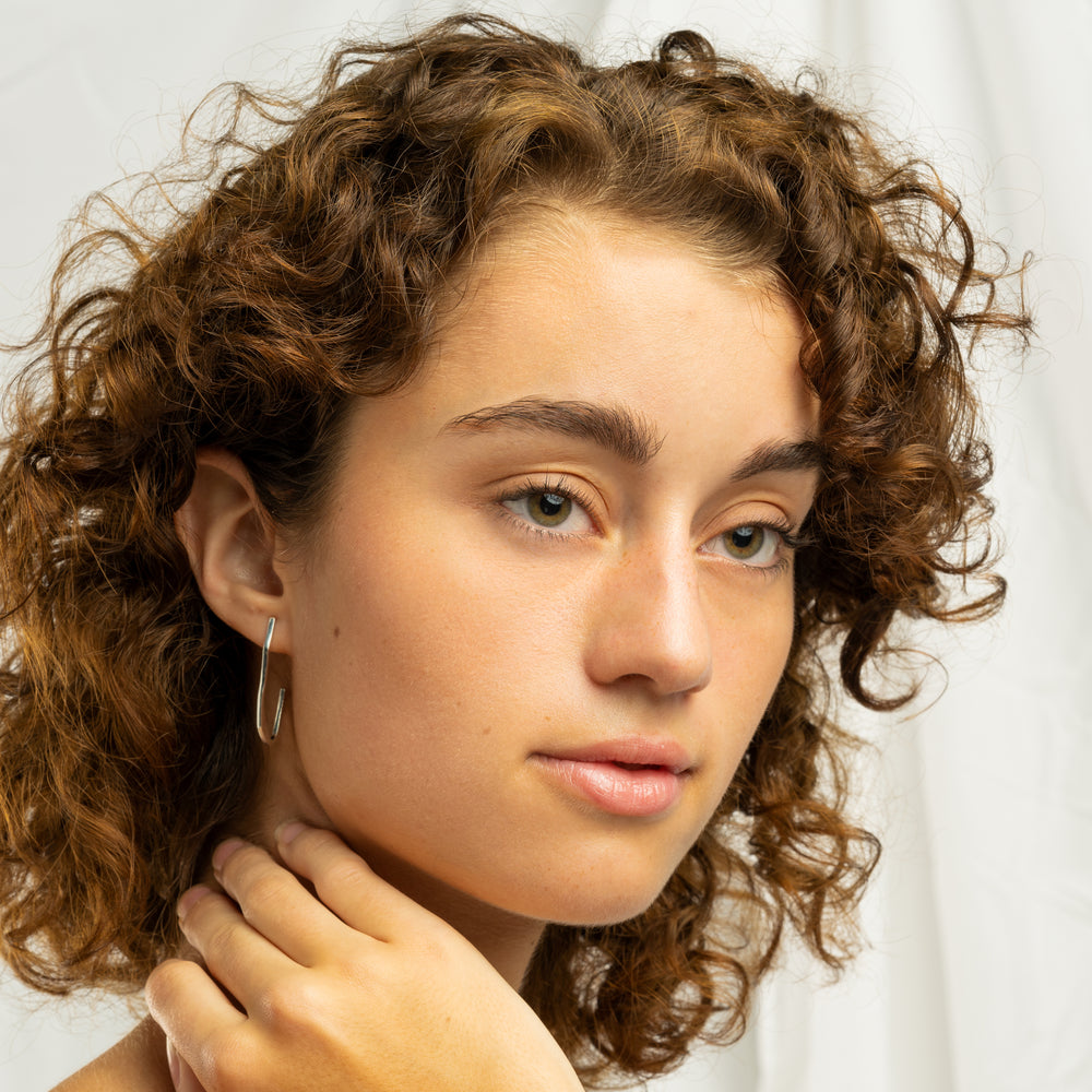 
                      
                        Wave Hoop Earrings
                      
                    