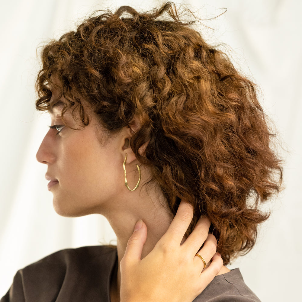 
                      
                        Wave Hoop Earrings
                      
                    