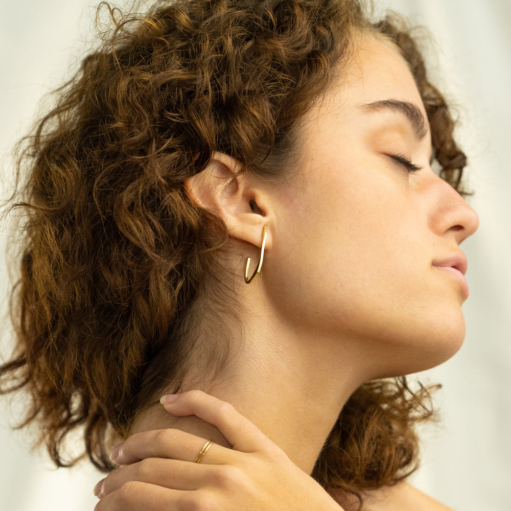 
                      
                        Wave Hoop Earrings
                      
                    