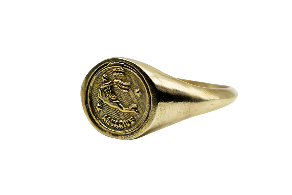 
            
                Load image into Gallery viewer, Vintage Brass Astrology Ring. Can be changed to Gold. This ring has Zodiac Aquarius. Handmade in a jewelry store in Brooklyn NYC
            
        
