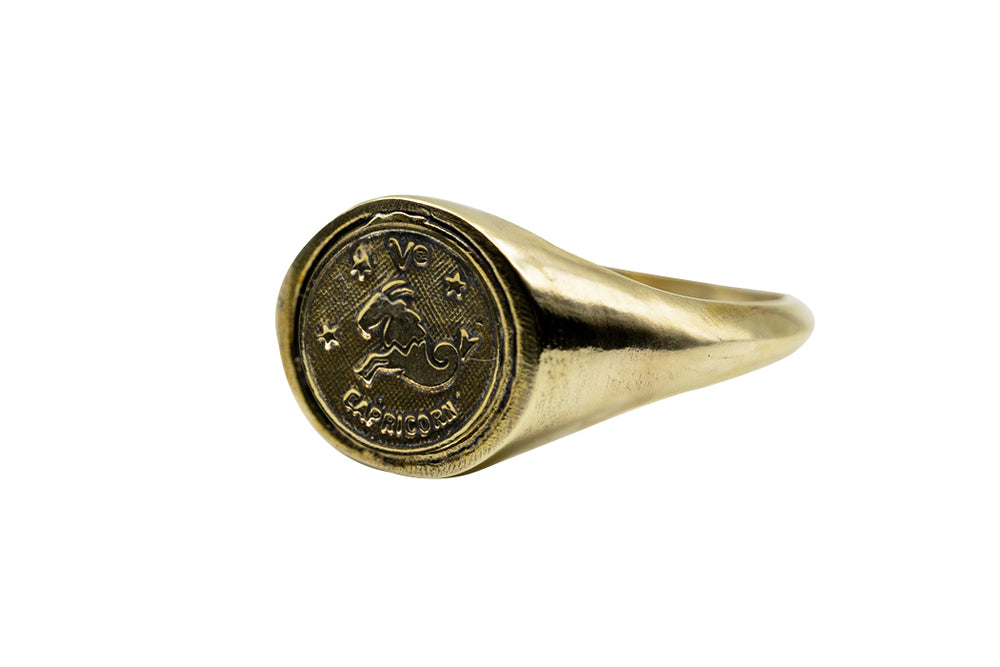 
            
                Load image into Gallery viewer, Vintage Brass Astrology Ring. Can be changed to Gold. This golden ring has Zodiac Capricorn. Handmade in a jewelry store in Brooklyn NYC
            
        