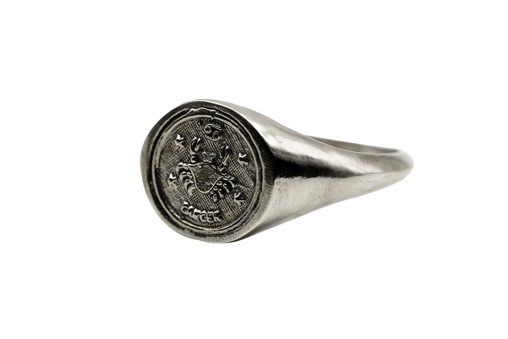 
                      
                        An Astrology Ring with Zodiac Cancer Side view. Piece of Men and Women Jewelry in Silver
                      
                    