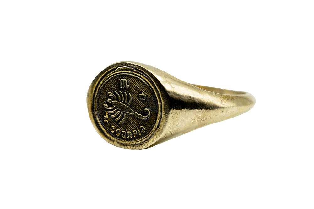 
            
                Load image into Gallery viewer, Vintage Brass Astrology Ring. Can be changed to Gold. This golden ring has Zodiac Scorpio. Handmade in a jewelry store in Brooklyn NYC
            
        