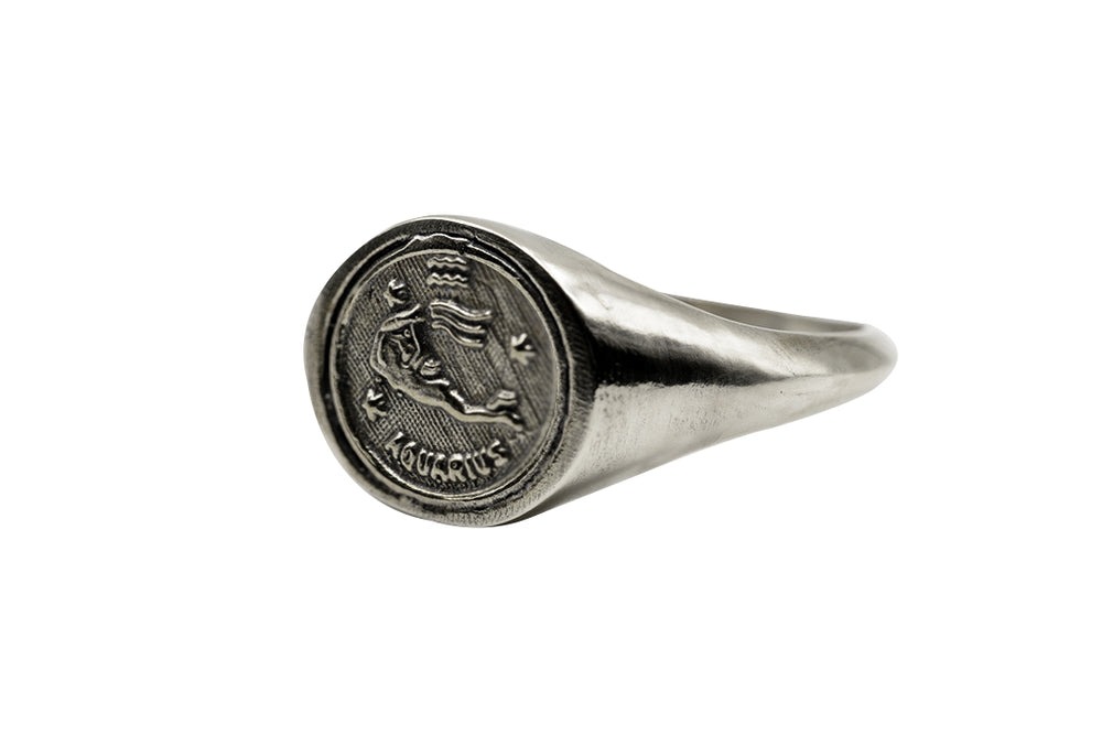 
                      
                        An Astrology Ring with Zodiac Aquarius Side Perspective. Piece of Men and Women Jewelry in Silver
                      
                    