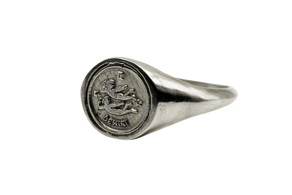 
                      
                        An Astrology Ring with Zodiac Gemini Side view. Piece of Men and Women Jewelry in Silver
                      
                    