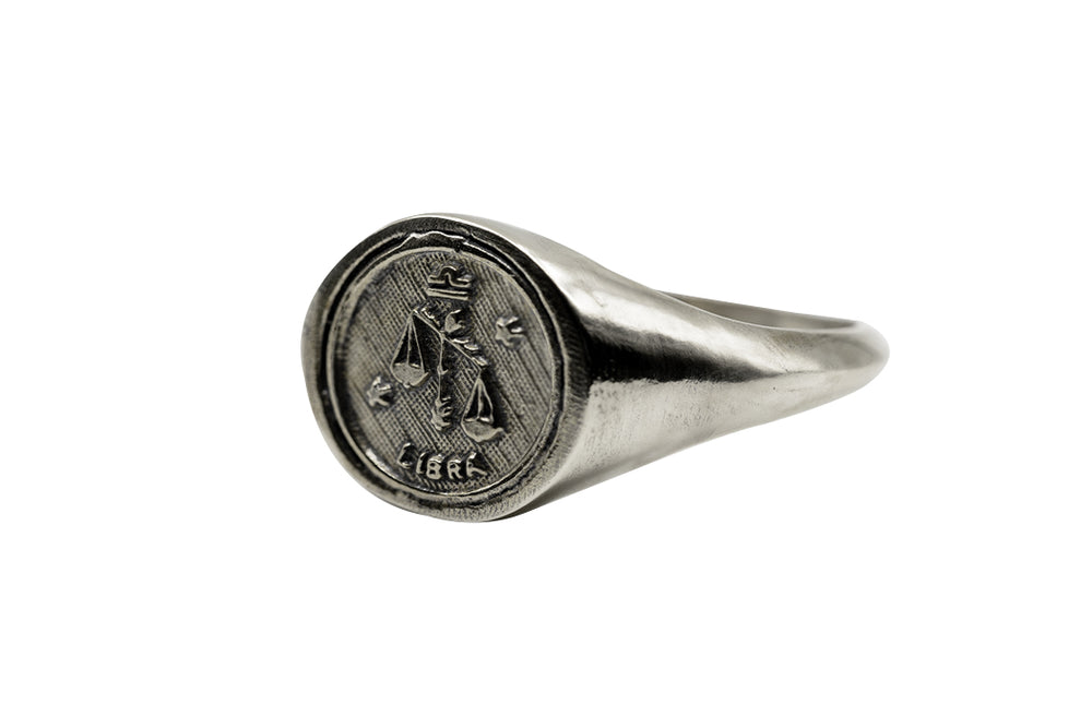 
                      
                        An Astrology Ring with Zodiac Libra Side view. Piece of Men and Women Jewelry in Silver
                      
                    