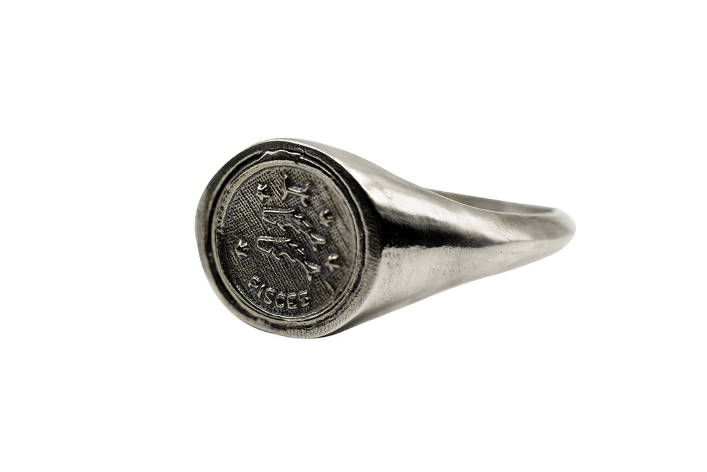 
                      
                        An Astrology Ring with Zodiac Pisces Side view. Piece of Men and Women Jewelry in Silver
                      
                    