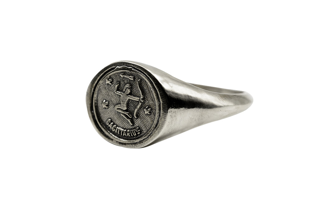 
                      
                        An Astrology Ring with Zodiac Sagittarius Side view. Piece of Men and Women Jewelry in Silver
                      
                    