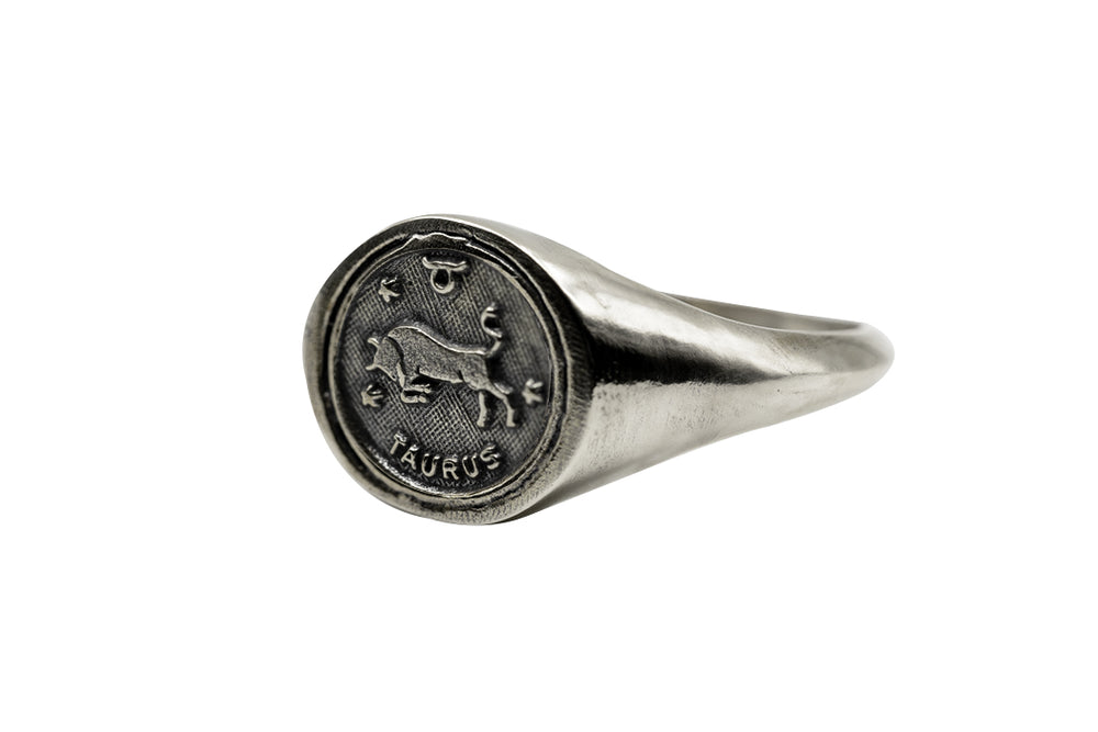 
                      
                        An Astrology Ring with Zodiac Taurus Side view. Piece of Men and Women Jewelry in Silver
                      
                    