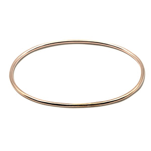 Vintage Classic Hammered Thin Bangle Bracelet made of 14k Rose Gold. Custom Handmade by jewelers in Brooklyn, NY.