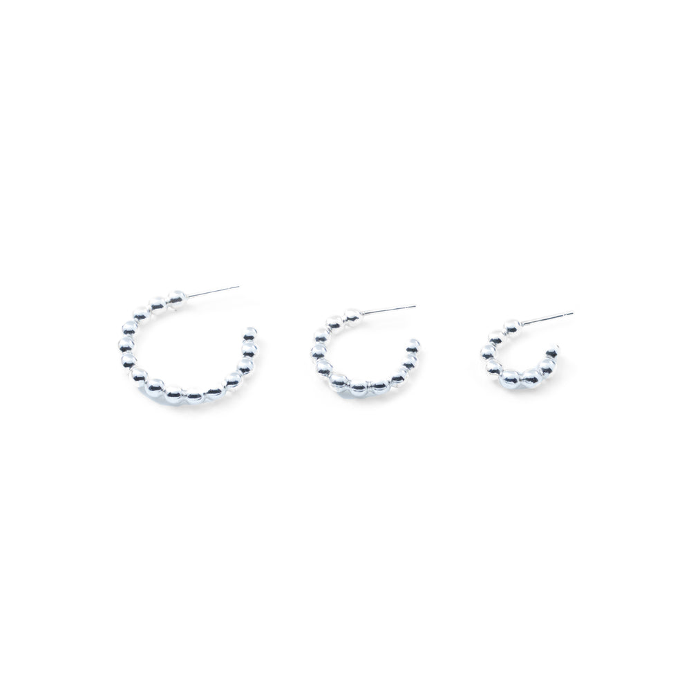 
            
                Load image into Gallery viewer, Thick Ball Hoop Earrings in Silver
            
        