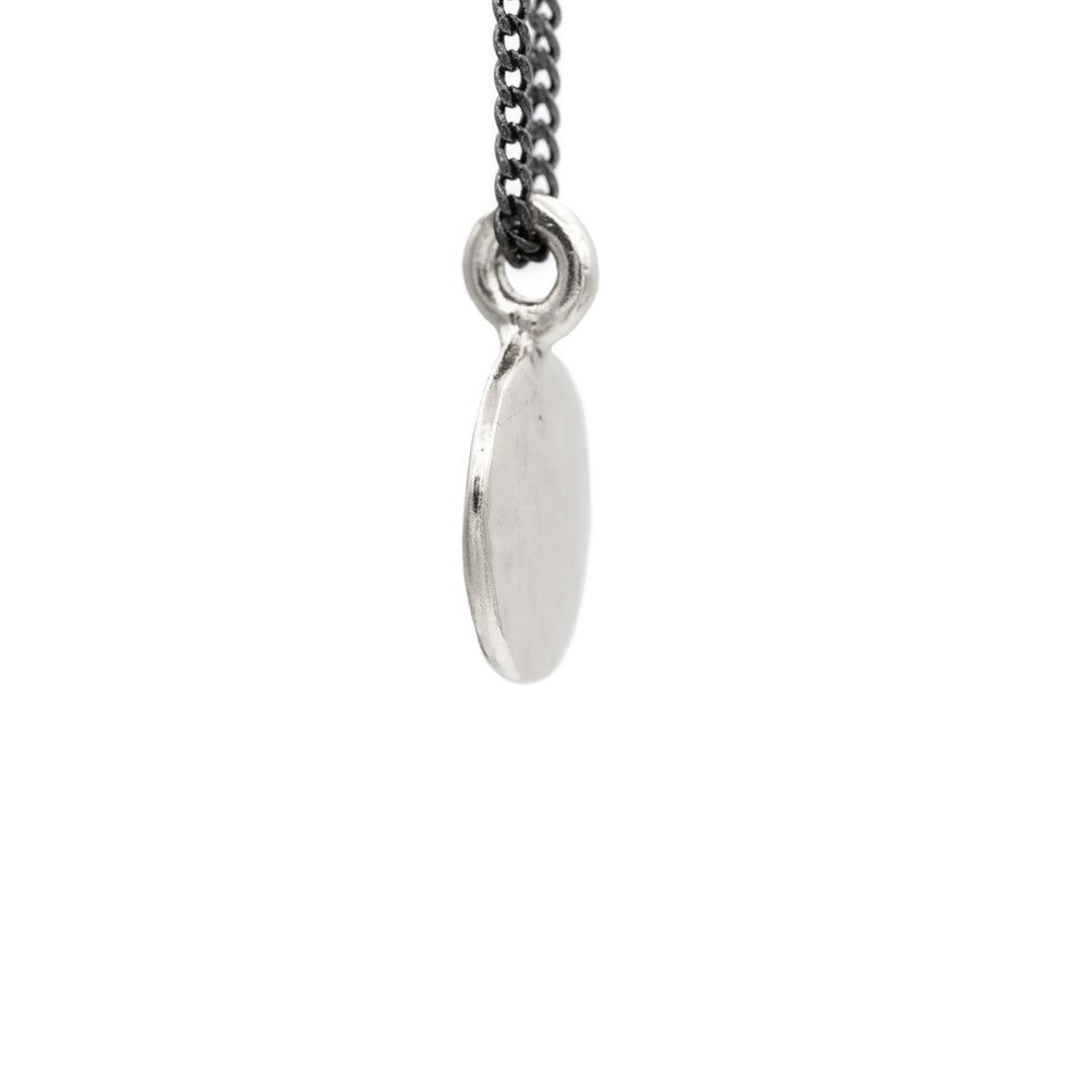 Vintage Simple Hammered Circle Charm Necklace made of solid sterling silver giving it a beautiful silver look. The pendant charm is on an oxidized silver chain.  Custom Handmade by jewelers in Brooklyn New York